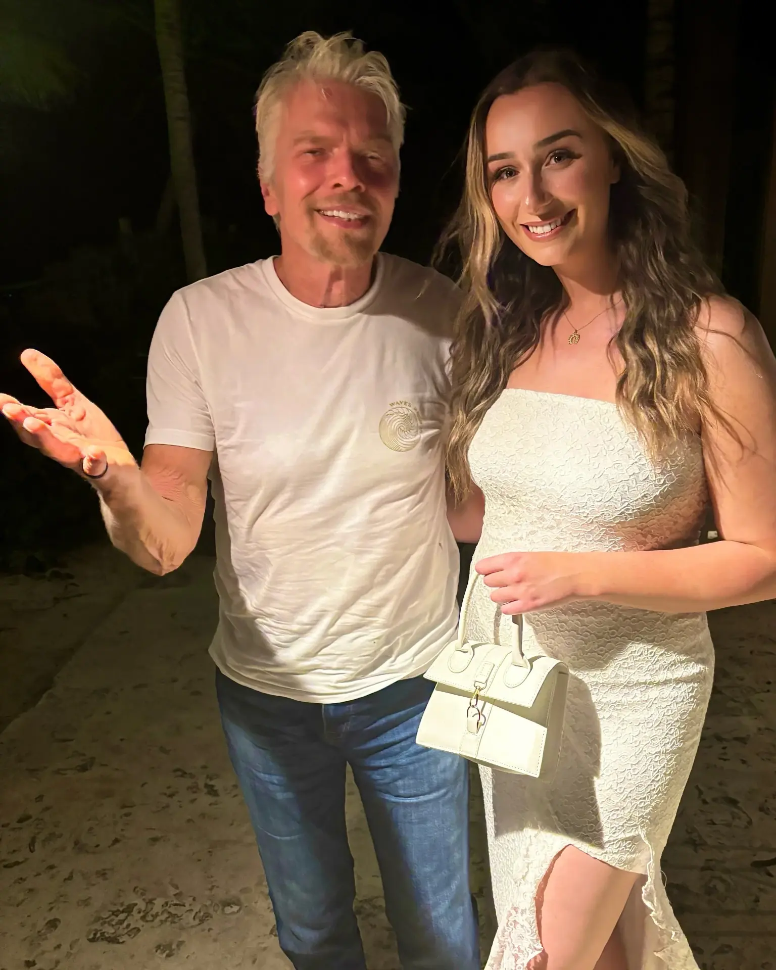 Brittany Garlin with Sir Richard Branson outdoors at night