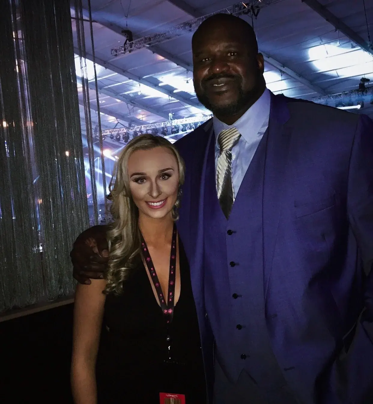 Brittany Garlin posing with Shaquille O'Neal at an arena gala